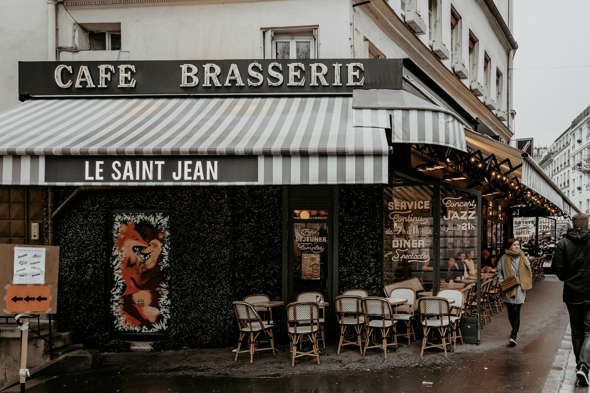 black and white restaurant with chairs and tables